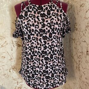 Stretch animal print top with criss cross at shoulders